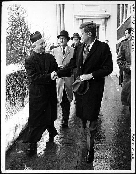 Newly Elected President John F. Kennedy  shown with Father Richard J. Casey, pastor of Holy Trinity Church, where J.F.K. attended Mass just prior to his inauguration on January 20, 1961