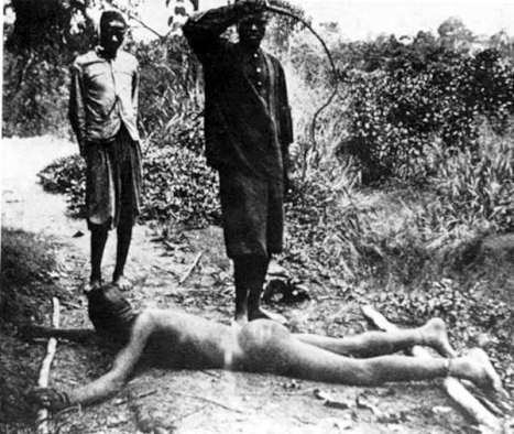Congolese villager being whipped with chicotte (a whip made with dried hippopotamus skin having razor sharp edges), likely for not meeting his rubber collection quota.